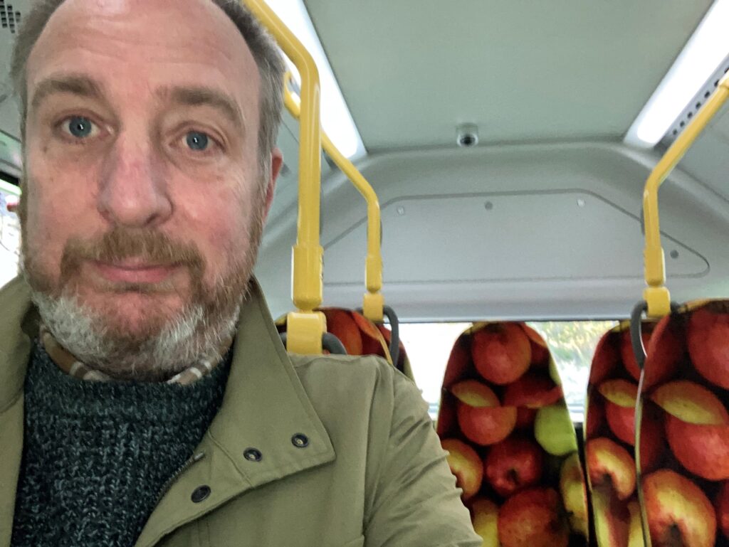 A man with a beard on a bus